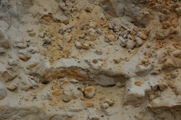 Sand texture from pile with grit and small stones.