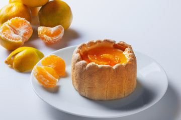 Biscuit cake with mascarpone cheese and jelly  from tangerines.