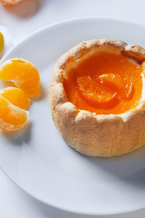 Biscuit cake with mascarpone cheese and jelly  from tangerines.