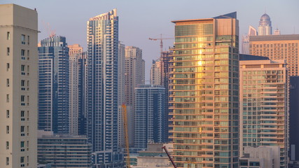 Aerial view of Dubai Marina from a vantage point at sunset timelapse.