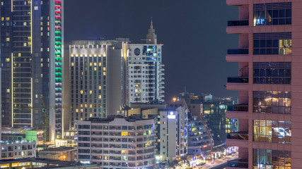 Fototapeta premium Aerial view of Dubai Marina from a vantage point night timelapse.