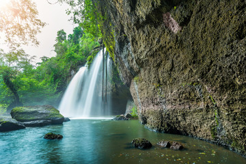 Fototapeta na wymiar Beauty in nature, amazing waterfall at tropical forest of national park, Thailand. Haew Suwat waterfall. 