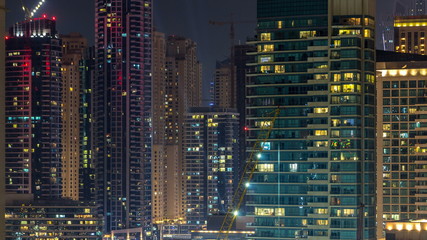 Fototapeta na wymiar Aerial view of Dubai Marina from a vantage point night timelapse.