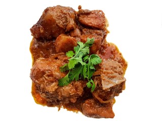 Thai food style, Top view of Pork curry are sprinkled with coriander isolated on white background, Kaeng Hung ley Moo is Thai traditional, This food is most popular