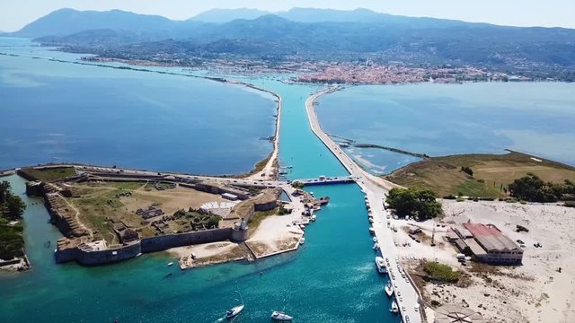 Aerial drone video of iconic landmark medieval Venetian Castle of Agia Mavra or Santa Mavra, Lefkada island town, Ionian, Greece