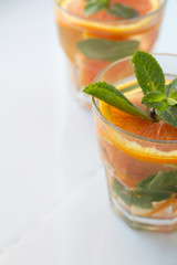 drink with orange and mint close up and place for text.