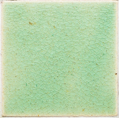 background and texture of stretch marks cracked on emerald green glazed tile