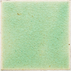 background and texture of stretch marks cracked on emerald green glazed tile