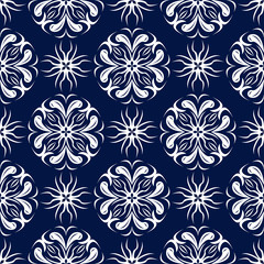 Floral seamless background. White design on dark blue backdrop