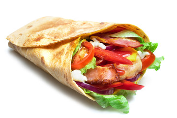 Shawarma sandwich isolated on white background. Gyro fresh roll with pita with grilled chicke, lettuce salad, bacon, tomato, sauces, cheese and vegetables. - obrazy, fototapety, plakaty