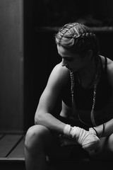 Fitness woman with the white boxing bandages. Attractive Female Boxer Training.