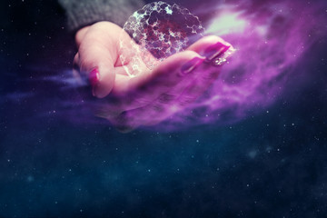 Fototapeta na wymiar Human hand holding with cell dividing. nebula dust. Mixed media.