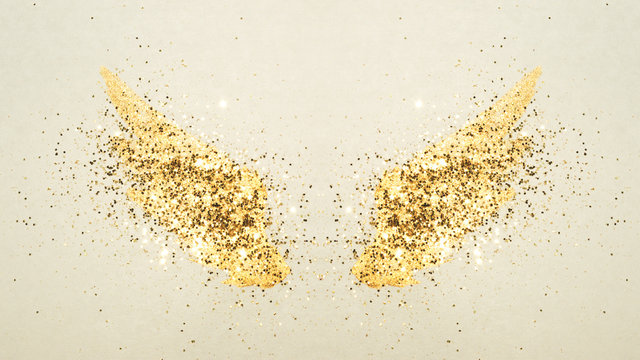 Golden glitter on abstract watercolor wings in vintage nostalgic colors.