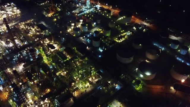 Aerial drone night video of famous full working plant and oil refinery of Motor Oil in Corinth area, Greece