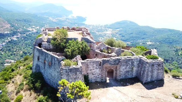 Aerial drone video of iconic castle of Ali Pasha overlooking bay and village of Parga, Epirus, Ionian, Greece