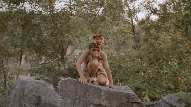 Prehistoric tribal man outdoors
