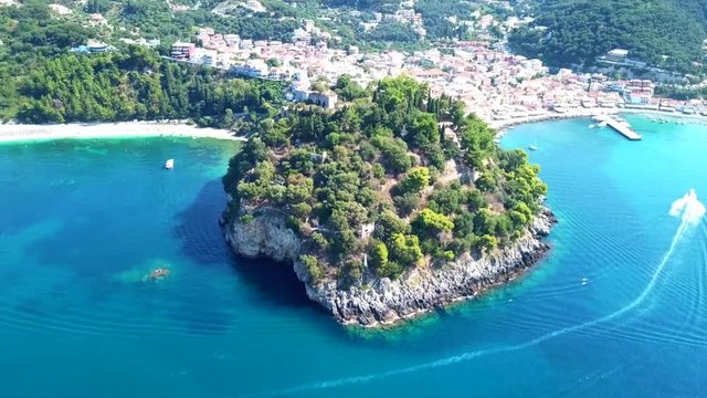 Aerial drone bird's eye view video of iconic and picturesque small fishing village of Parga, Epirus, Ionian, Greece