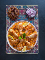 Homemade chicken Biryani. Arabic traditional food bowls Kabsa with meat. Top view. 
