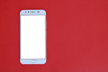 Mobile phone on a red background
