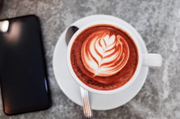 Coffee cup on the marble desk concept