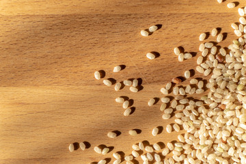 Raw Brown Rice On A wooden table. Organic Brown Rice On A table.