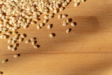 Raw Brown Rice On A wooden table. Organic Brown Rice On A table.