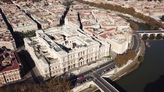 Aerial drone bird's eye view video of famous Cavour square and iconic neoclassic building of Supreme Court of Cassation (Italian: Corte Suprema di Cassazione), Rome, Italy