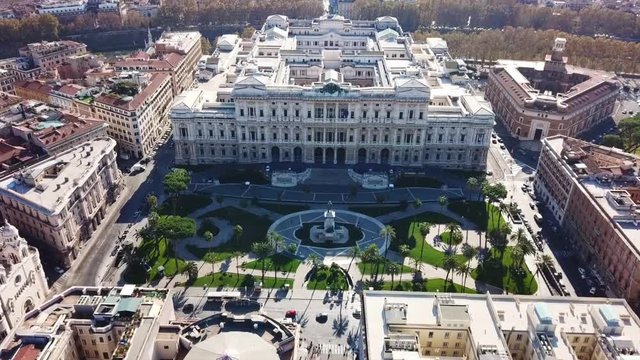 Aerial drone bird's eye view video of famous Cavour square and iconic neoclassic building of Supreme Court of Cassation (Italian: Corte Suprema di Cassazione), Rome, Italy