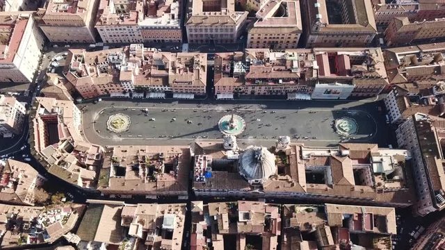 Aerial drone video of iconic landmark Piazza Navona (Square) featuring Fountain of the Four Rivers with an Egyptian obelisk and Sant Agnese Church in the heart of Rome, Italy