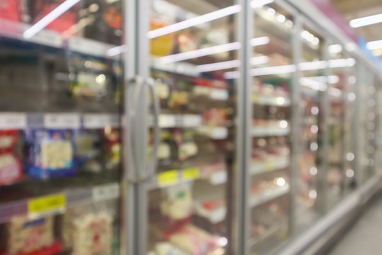 Supermarket Commercial Refrigerators Freezer Showing Frozen Foods Abstract Blur Background