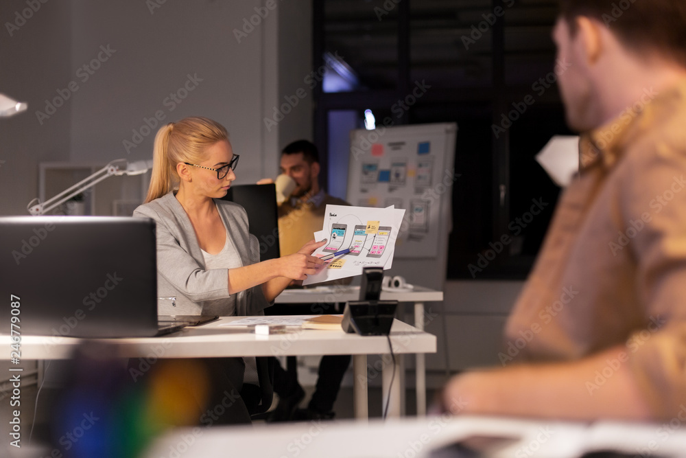 Poster business, deadline and technology concept - software developers discussing user interface design moc