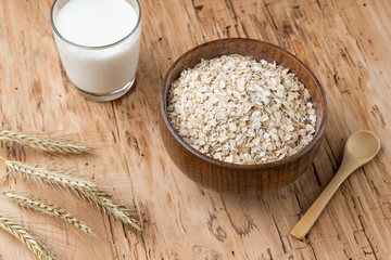 Bowl of oats on a old wooden background