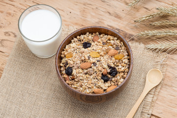 Mixed Muesli with a glass of Milk on wooden background