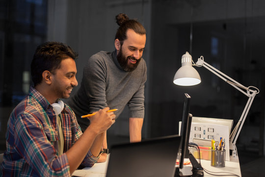 Deadline, Technology And People Concept - Creative Team With Computers Working Together Late At Night Office