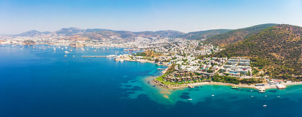 Panoramic aerial view of sunny Bodrum with resorts and beachfront villas - obrazy, fototapety, plakaty