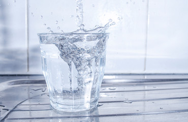 Water Splashing in a Glass
