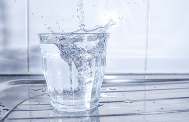 Water Splashing in a Glass