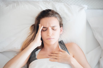 Woman at home, stress or pain