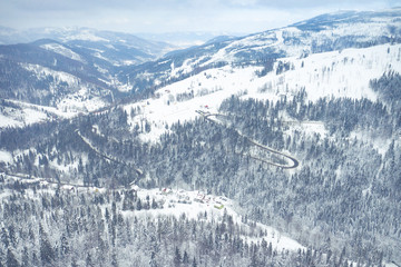 Winter scenery in Silesian Beskids mountains. View from above. Landscape photo captured with drone. Poland, Europe.