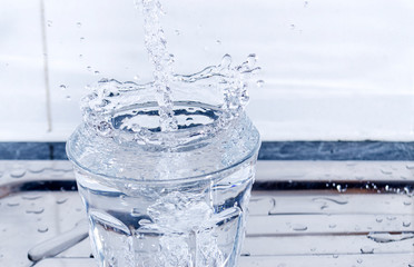 Water Splashing into a Glass