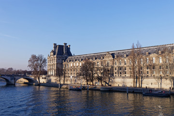 Louvre Palace in front of Seine river - Paris, France