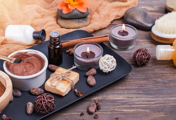 Chocolate spa set on the wooden background, close-up.