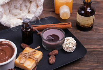 Chocolate spa set on the wooden background, close-up.