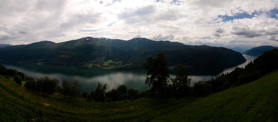 Landscape panoramic view to innvikfjorden, innvik and utvik village, Norway