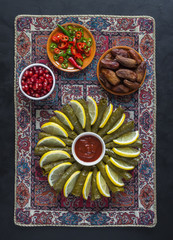 Arab dolma of grape leaves with pomegranate seeds.