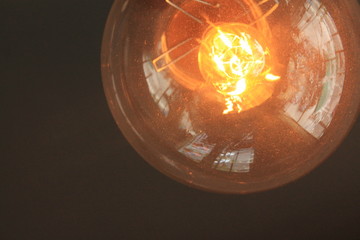 Vintage lightbulb shining dimly in a nadir shot