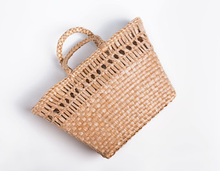 Straw bag basket isolated on the white backgroun