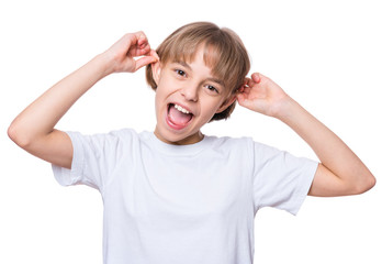 White t-shirt on teen girl. Silly girl making grimace - funny monkey face. Concept of childhood and fashion or advertisement design. Mock up template for design print.