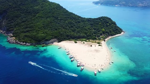 Aerial drone video from famous for Caretta caretta sea turtle haching, exotic small island of Marathonisi with white caves and sapphire sea and sandy beach , Zakynthos island, Ionian, Greece