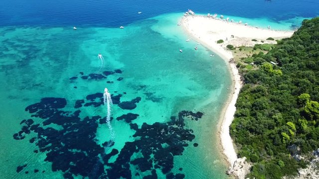 Aerial drone video from famous for Caretta caretta sea turtle haching, exotic small island of Marathonisi with white caves and sapphire sea and sandy beach , Zakynthos island, Ionian, Greece